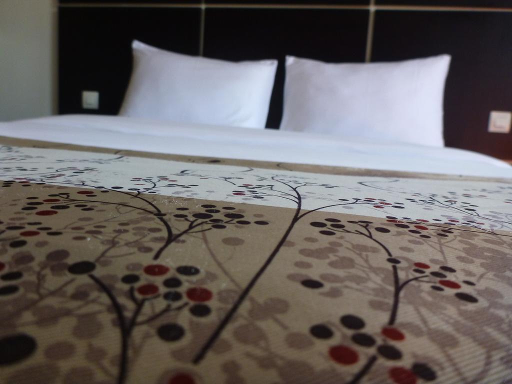 Détente Hôtel Abiyán Habitación foto